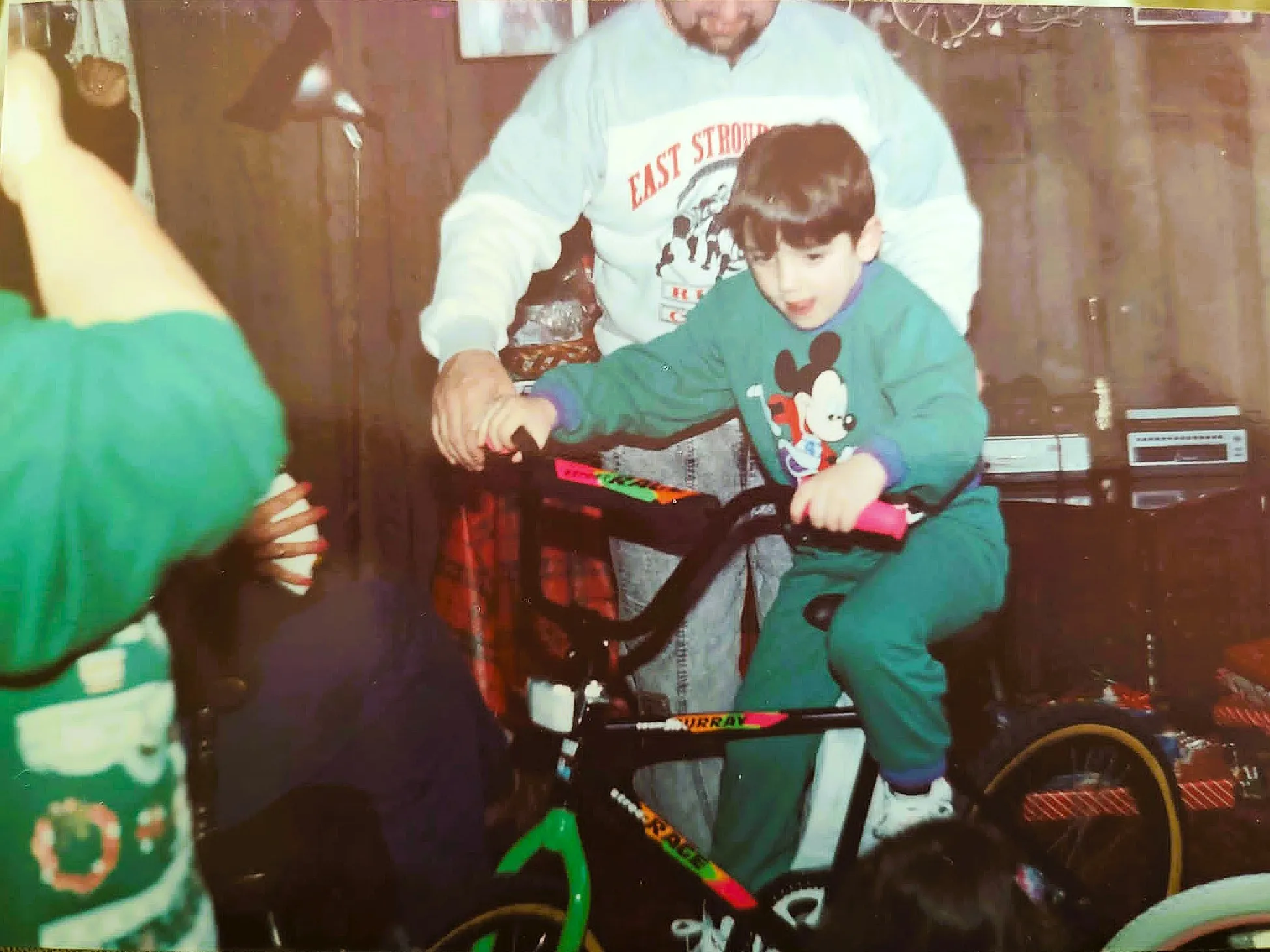 A young Ryan DeLarco getting his first bike, with a little help from dad
